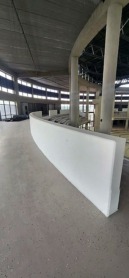 Curved cast concrete reception counter finished on a commercial fit out