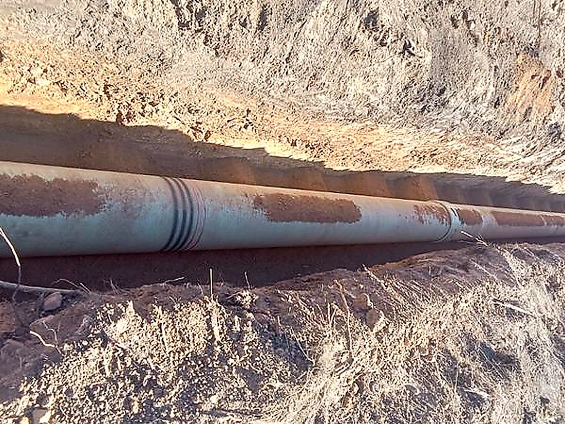 Steel bulk water pipeline laid and welded in an open excavation