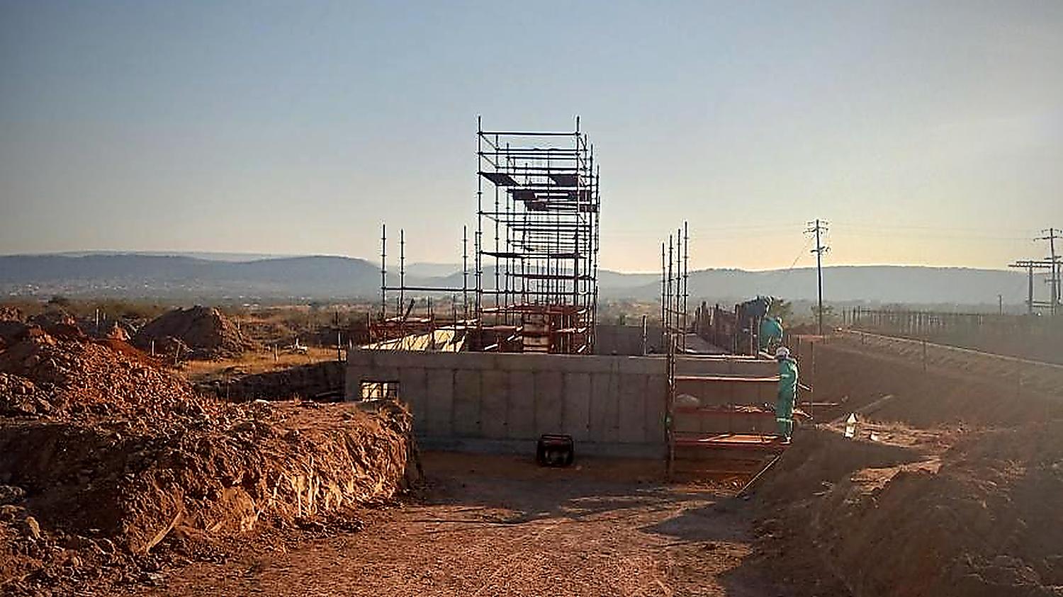 Concrete structure and scaffolding at sunset on a Malanc Projects site