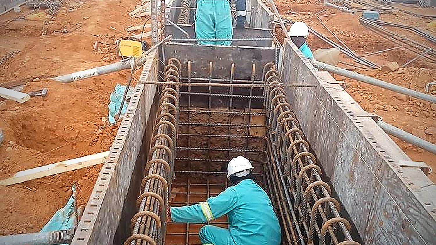 Steel fixing team tying reinforcement cages on a Malanc Projects civil site